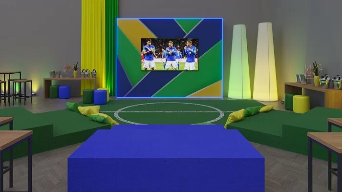 Arena Blue Tree, espaço com tons em verde e amarelo e tema de futebol. A rede lança programação exclusiva durante jogos no Catar.